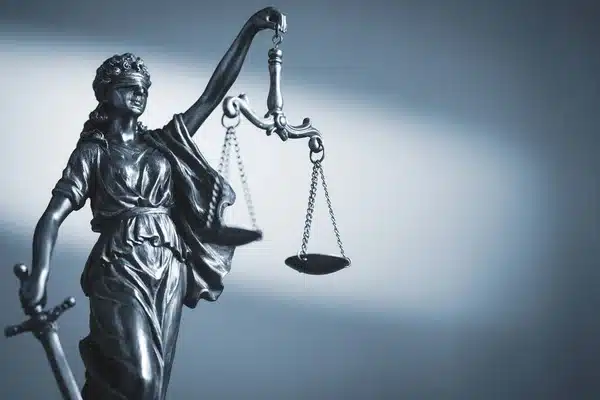 depositphotos  stock photo figure of justice holding scales.webp